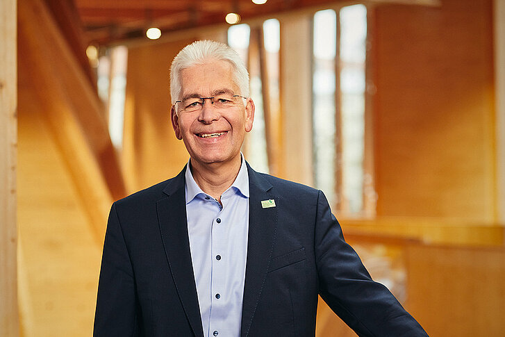 Dr. Bernhard Widmann, head of the TFZ, smiles at the camera inside the NAWAREUM.